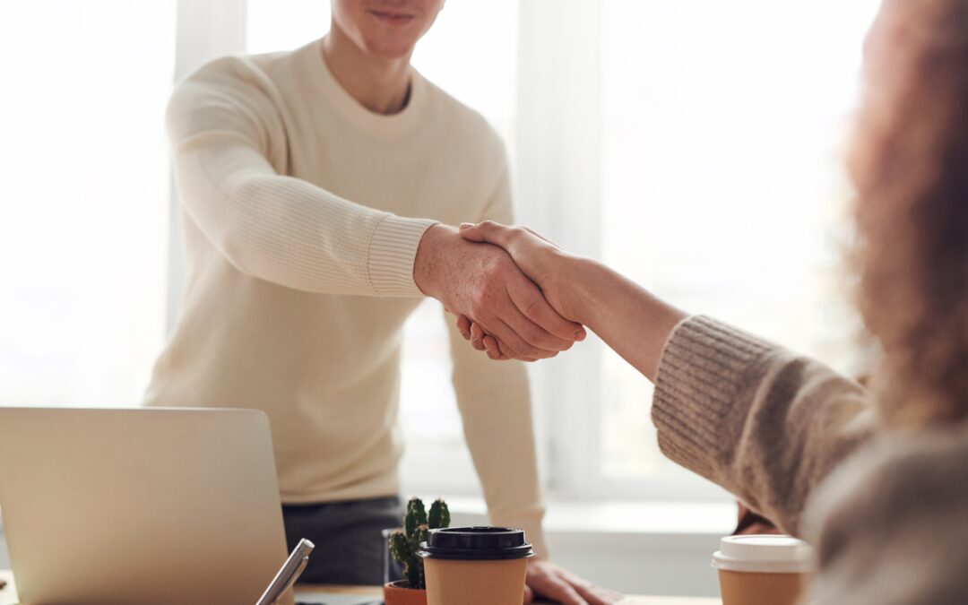 2 people shaking hands after an interview